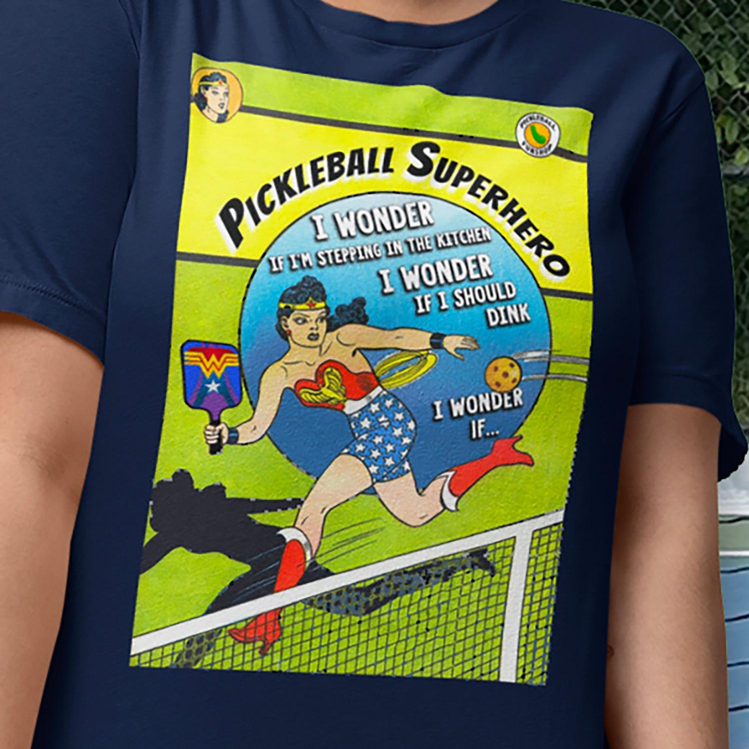 Closeup view of Wonder Woman pickleball graphic on front of Women's Navy blue tshirt