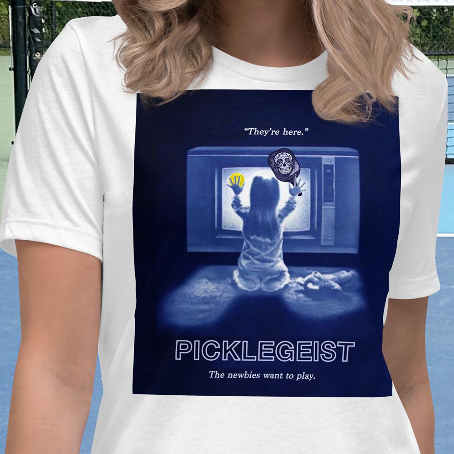 Closeup view of Picklegeist graphic on front of White short-sleeve women's pickleball shirt