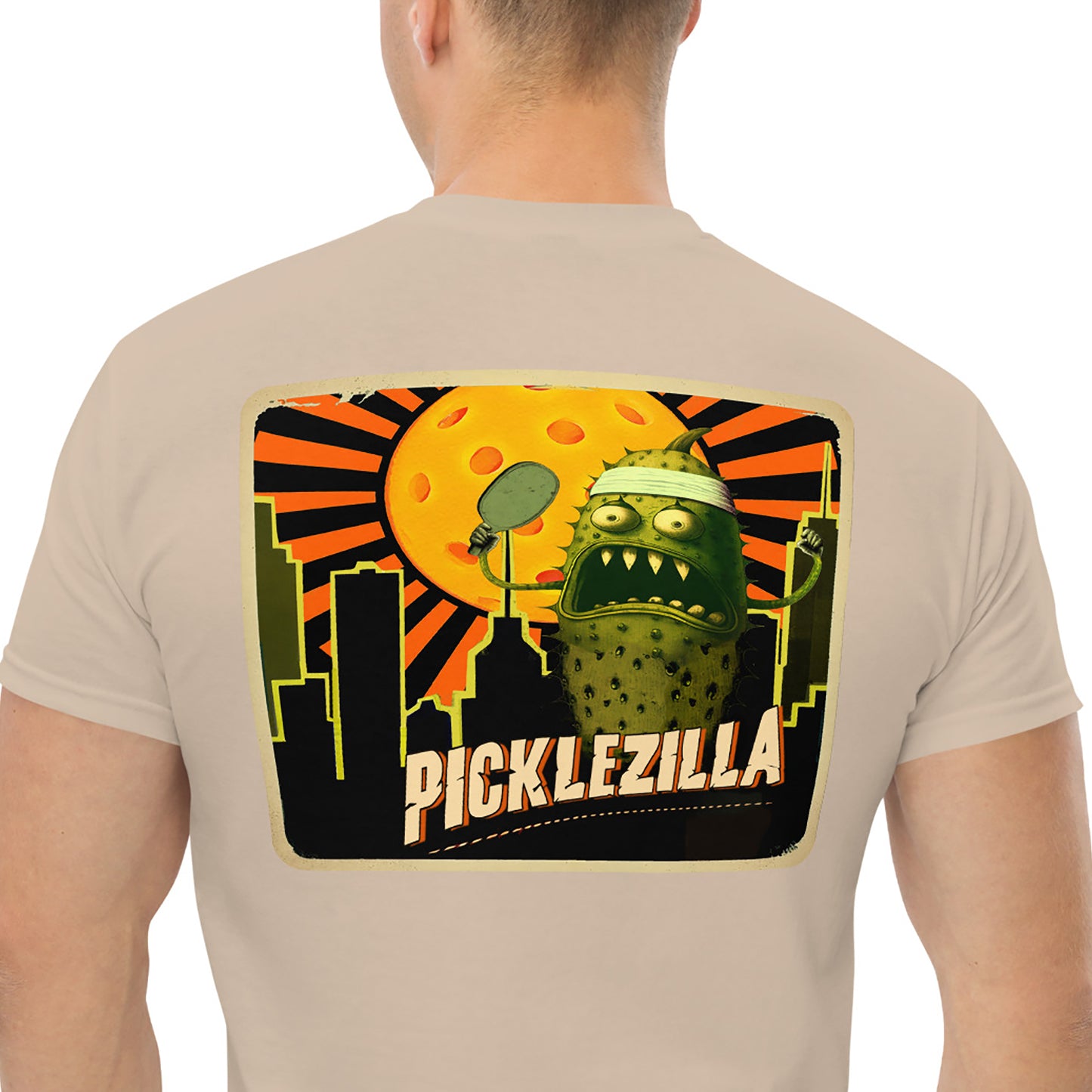 Closeup view of Picklezilla graphic on back of Mens t-shirt, sand color